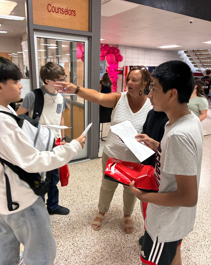 principal pointing with kids