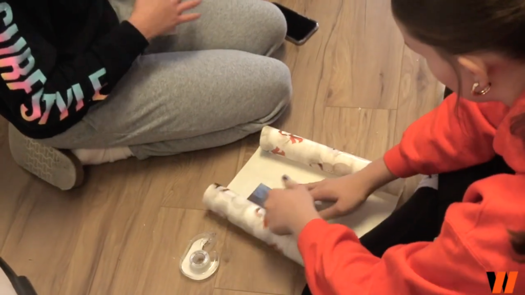 Student wrapping a present