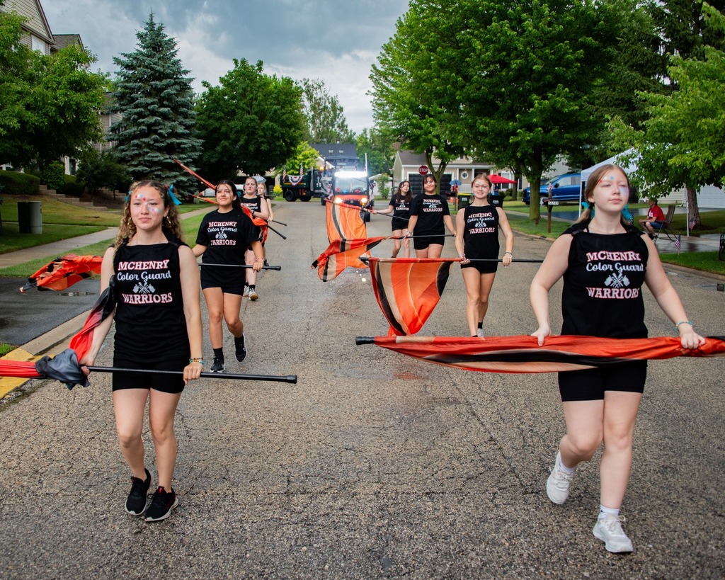 MCHS Marching Band and Color Guard members in the July 4 parades