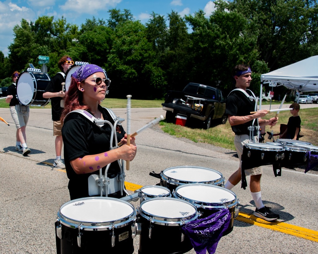 MCHS Marching Band and Color Guard members in the July 4 parades