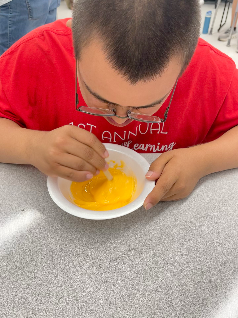Students stirring slime