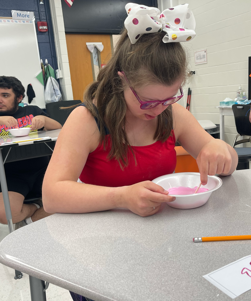 Student stirring slime