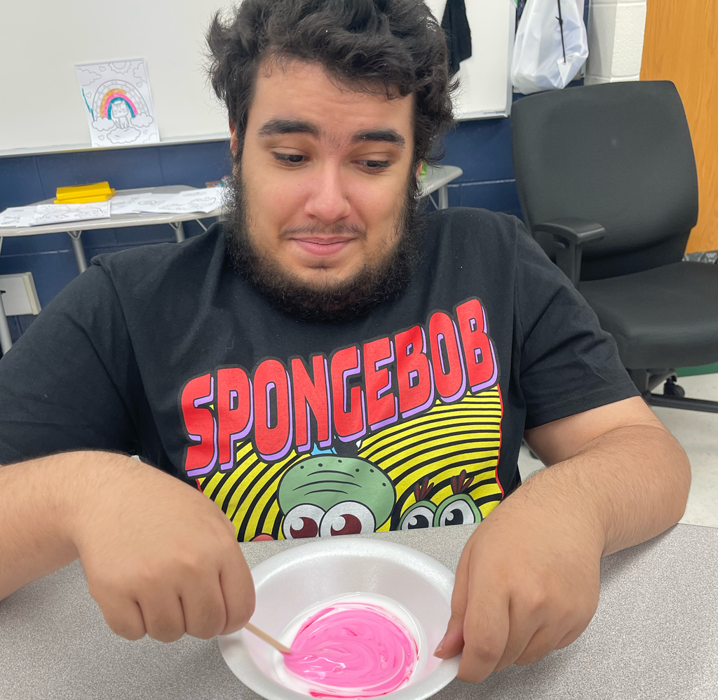Student stirring slime