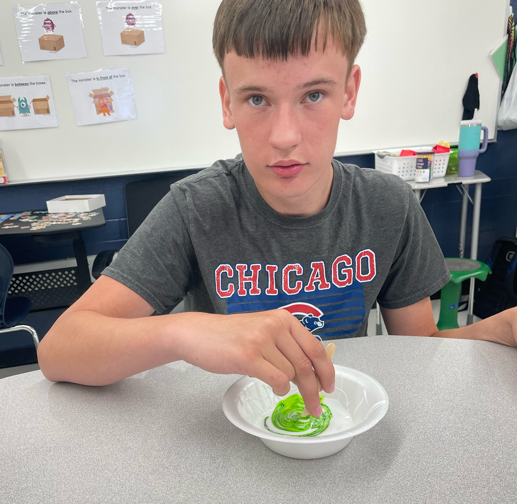 Student mixing slime
