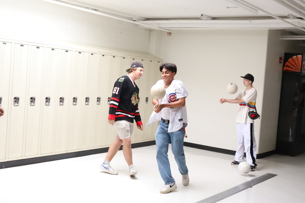 Two students with volleyballs 