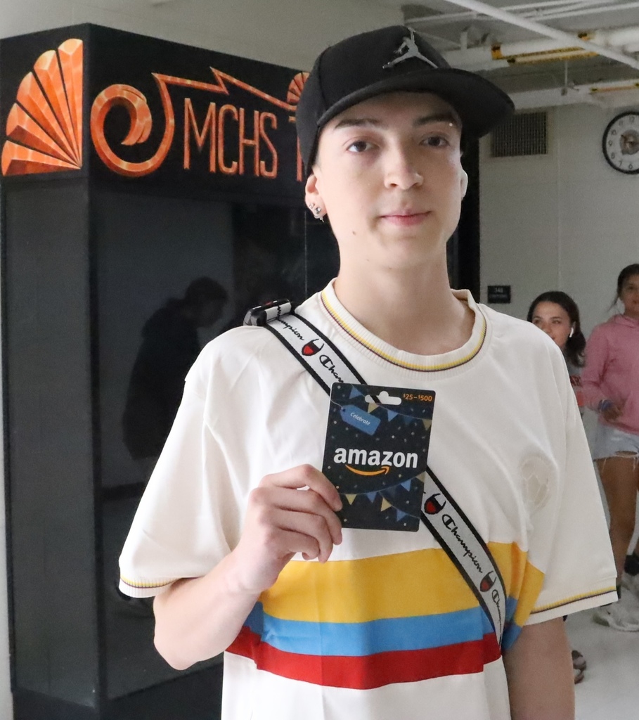 Student holding Amazon gift card