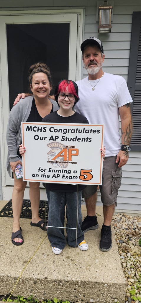Student with AP 5 sign: MCHS Congratulates our AP  for earning a 5 on the AP exam