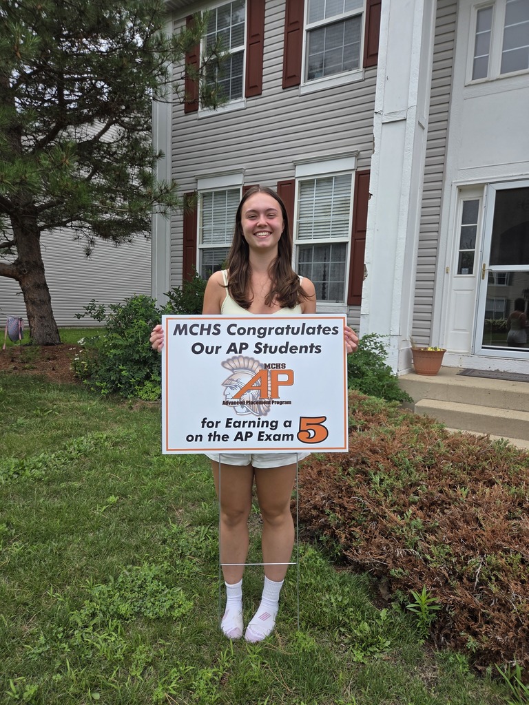Student with AP 5 sign: MCHS Congratulates our AP  for earning a 5 on the AP exam