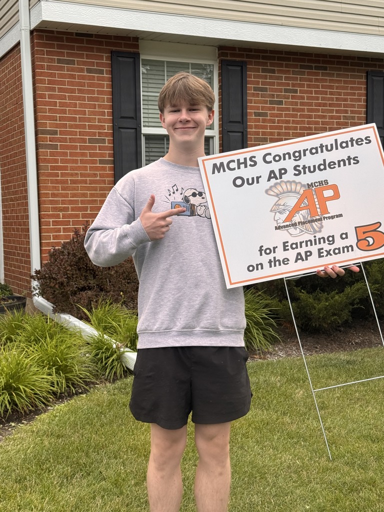 Student with AP 5 sign: MCHS Congratulates our AP  for earning a 5 on the AP exam