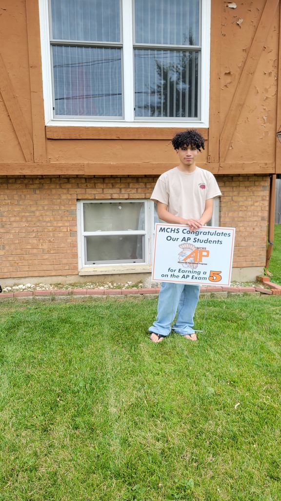 Student with AP 5 sign: MCHS Congratulates our AP  for earning a 5 on the AP exam