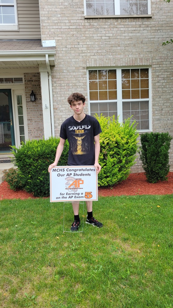Student with AP 5 sign: MCHS Congratulates our AP  for earning a 5 on the AP exam