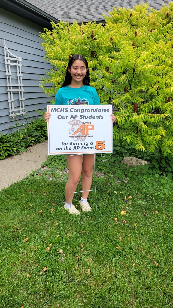 Student with AP 5 sign: MCHS Congratulates our AP  for earning a 5 on the AP exam