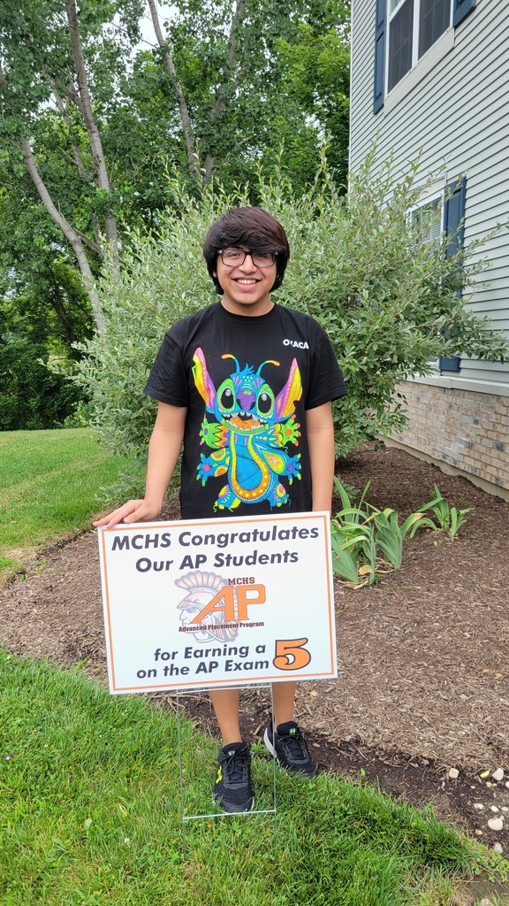 Student with AP 5 sign: MCHS Congratulates our AP  for earning a 5 on the AP exam