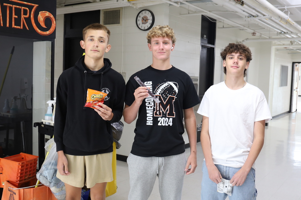 Three students with snacks