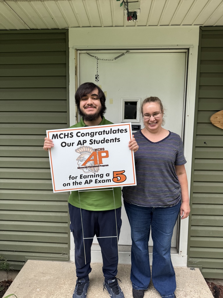 Student with AP 5 sign: MCHS Congratulates our AP  for earning a 5 on the AP exam