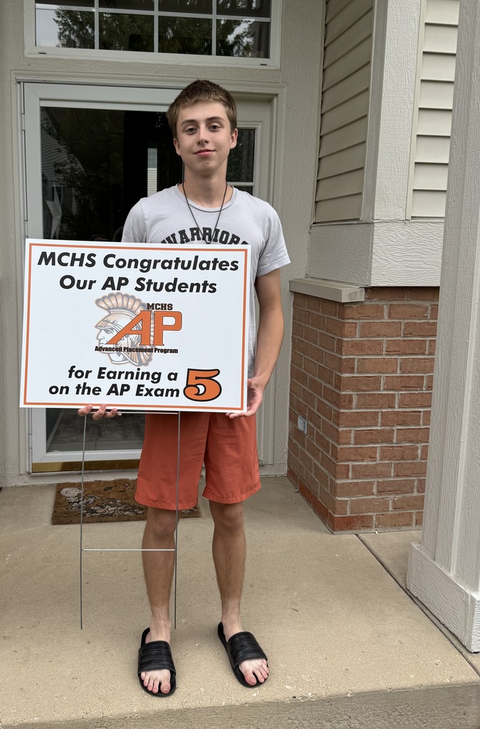 Student with AP 5 sign: MCHS Congratulates our AP  for earning a 5 on the AP exam