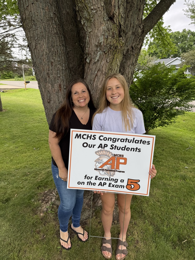 Student with AP 5 sign: MCHS Congratulates our AP  for earning a 5 on the AP exam
