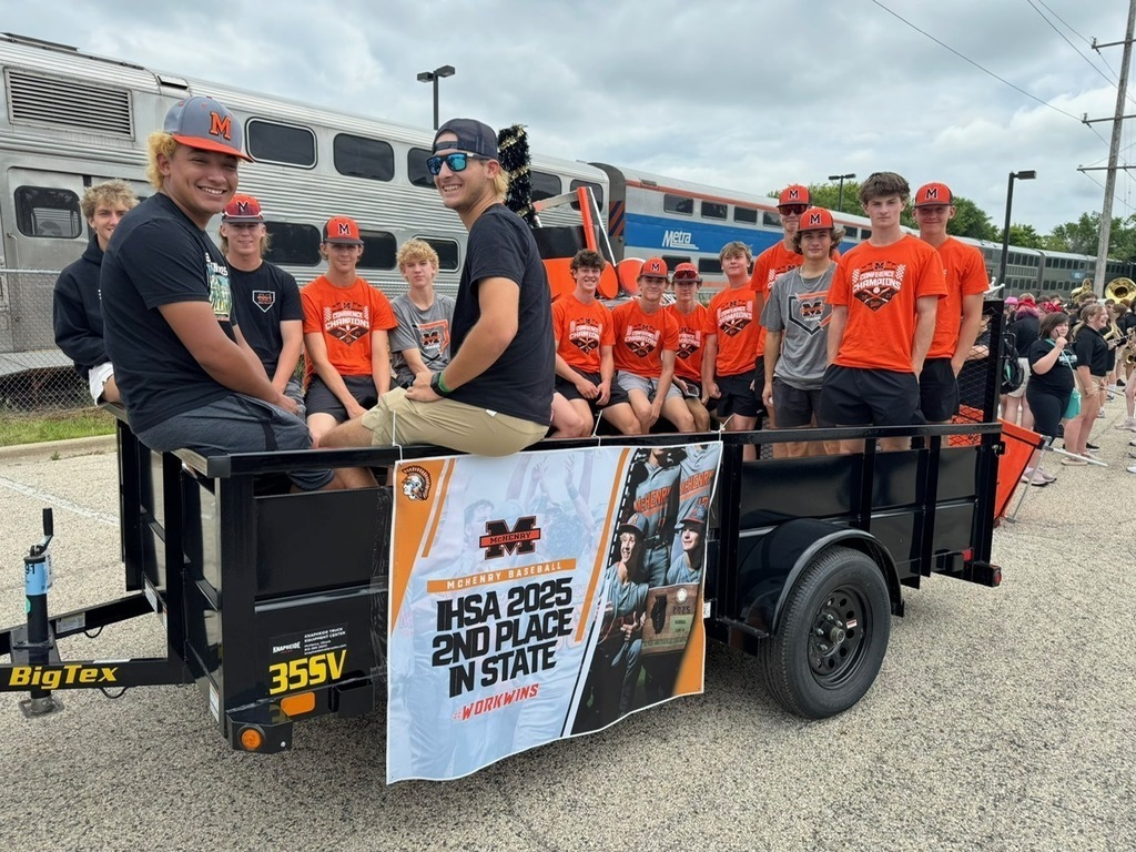 Baseball boys on a float that says IHSA 2025 2nd Place in State Work Wins