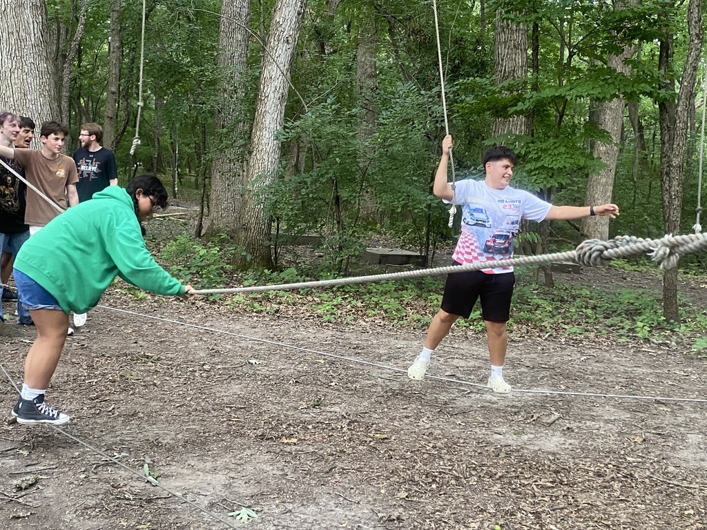 Two students on a ropes course