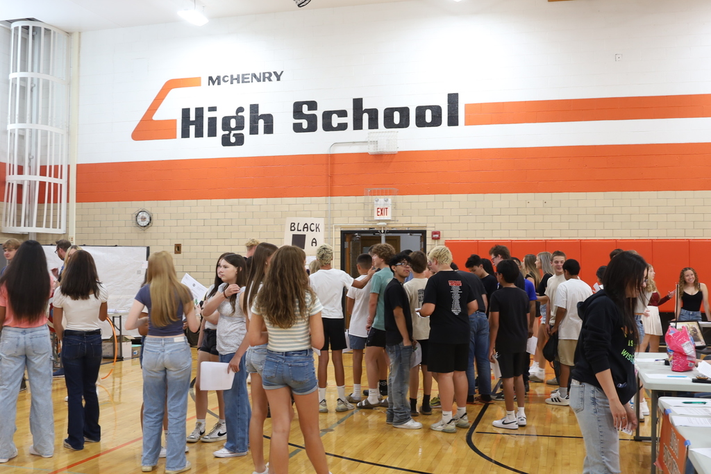 Students standing int he gym 