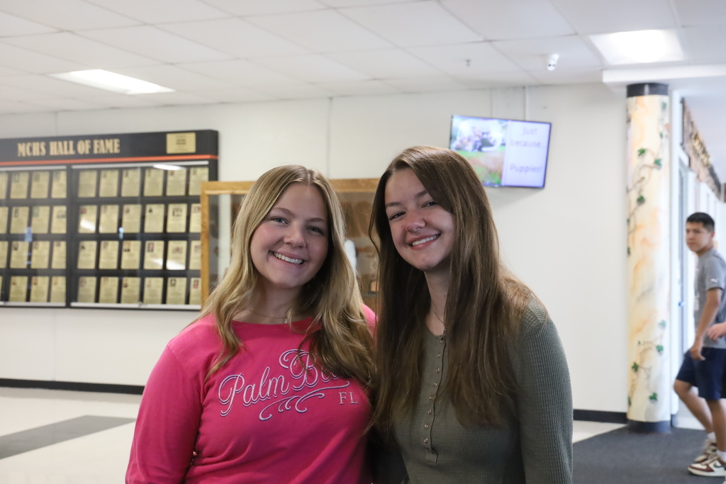 Two students smiling 