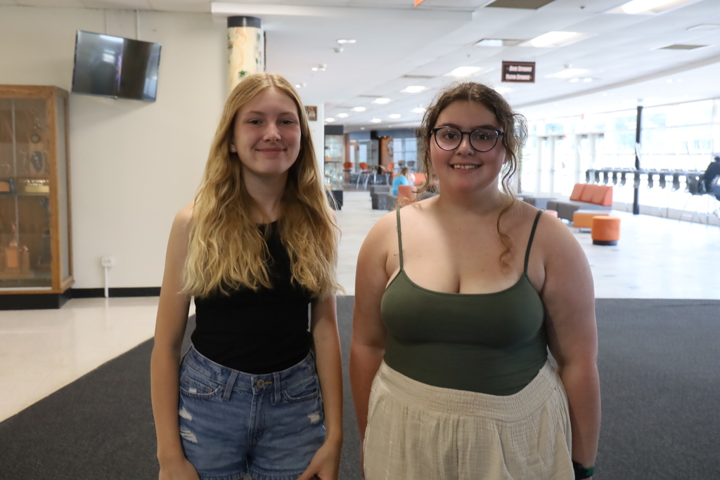 Two students smiling 