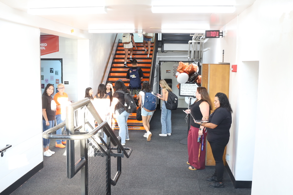 Students walking in up the stairs
