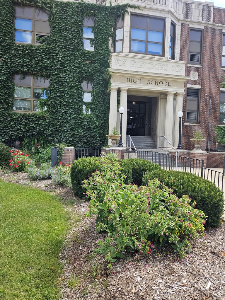 The front of Freshman Campus with flowers