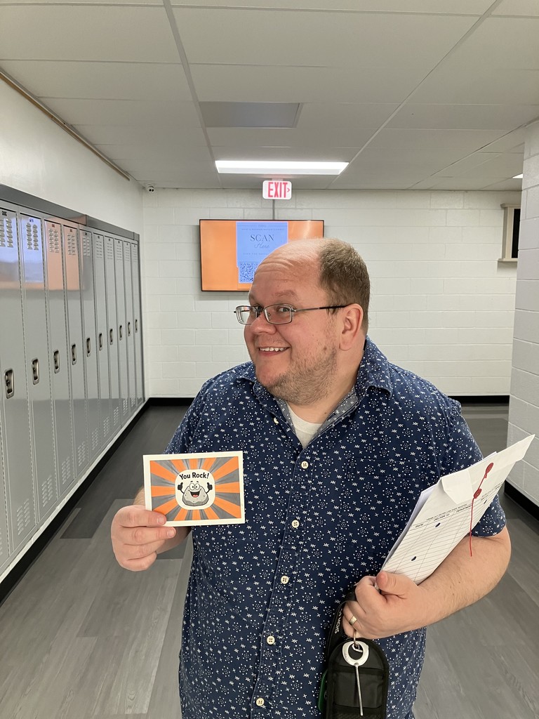 Andy Hillier holding you rock card