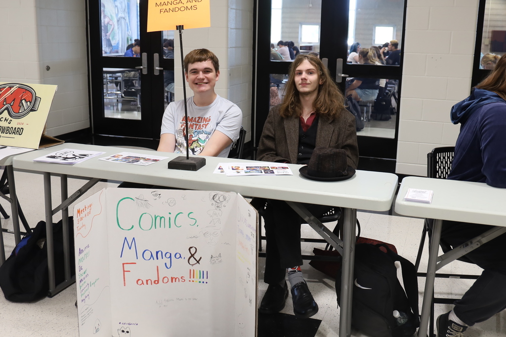 Comics Manga and Fandoms booth with two students