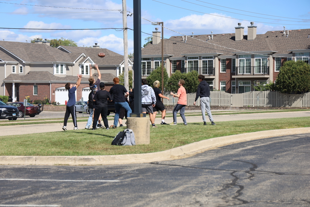 Students playing football for fun