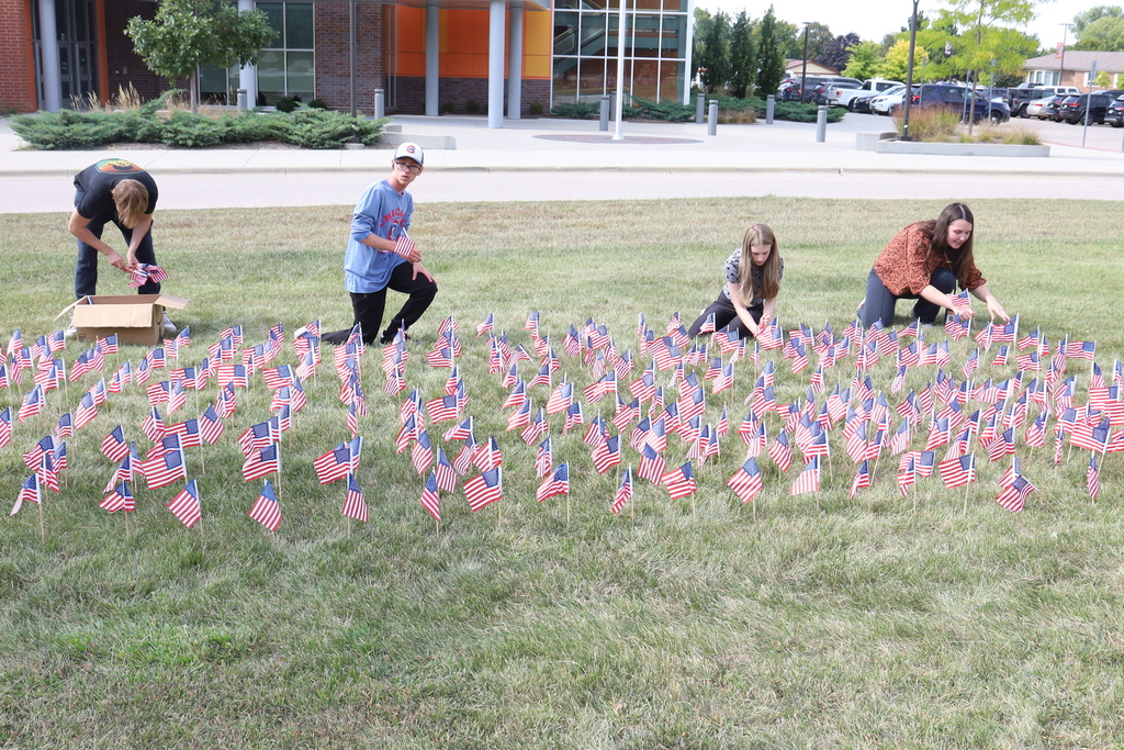 Students setting up flags