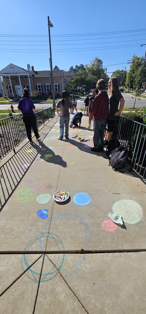 Students by the sidewalk, chalk drawn on the sidewalk