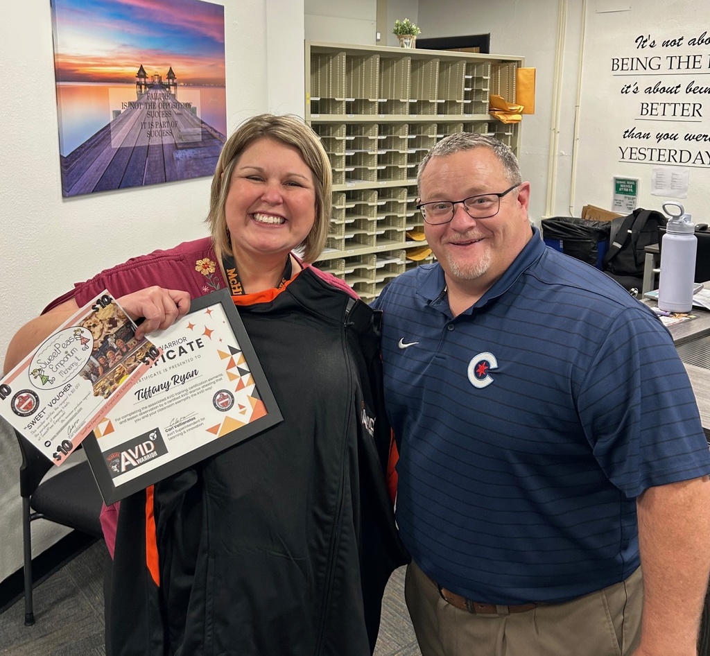 Tiffany Ryan with her award and gift certificate next to Carl Vallianatos.