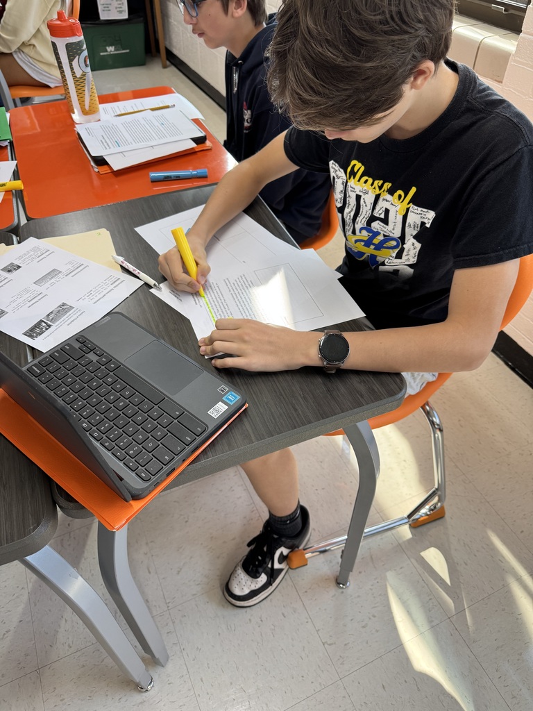 Photo of a business student at MCHS uses AVID strategies of using essential questions and focused note taking to help them understand, process, and apply course content.
