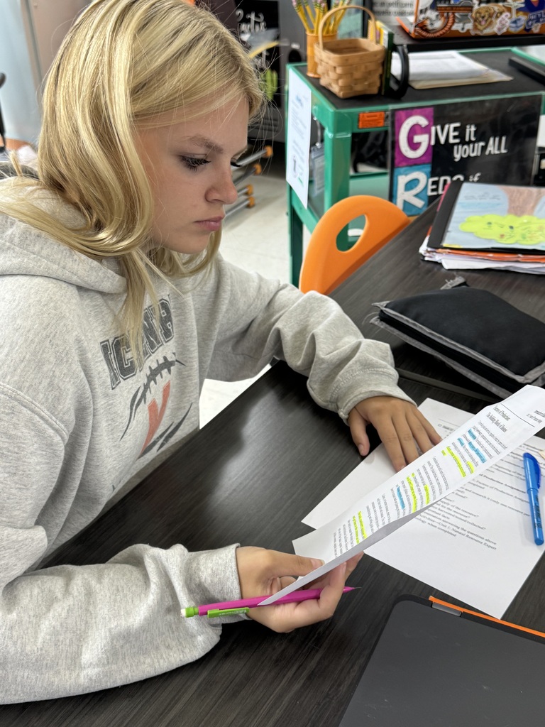 Photo of a business student at MCHS uses AVID strategies of using essential questions and focused note taking to help them understand, process, and apply course content.