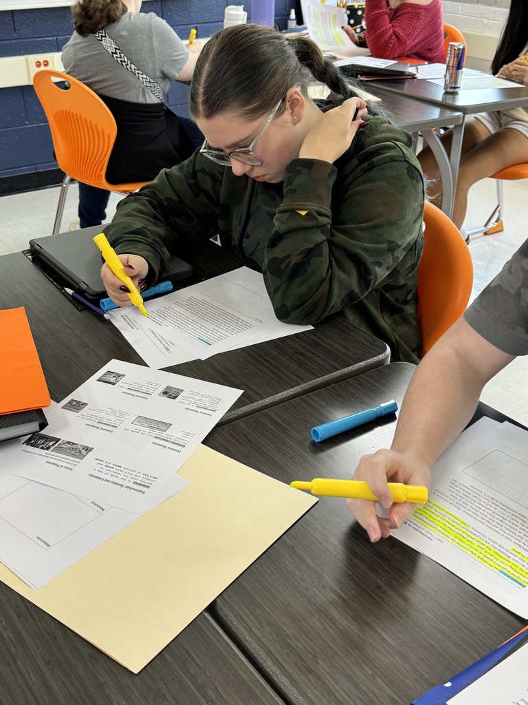 Photo of a business student at MCHS uses AVID strategies of using essential questions and focused note taking to help them understand, process, and apply course content.