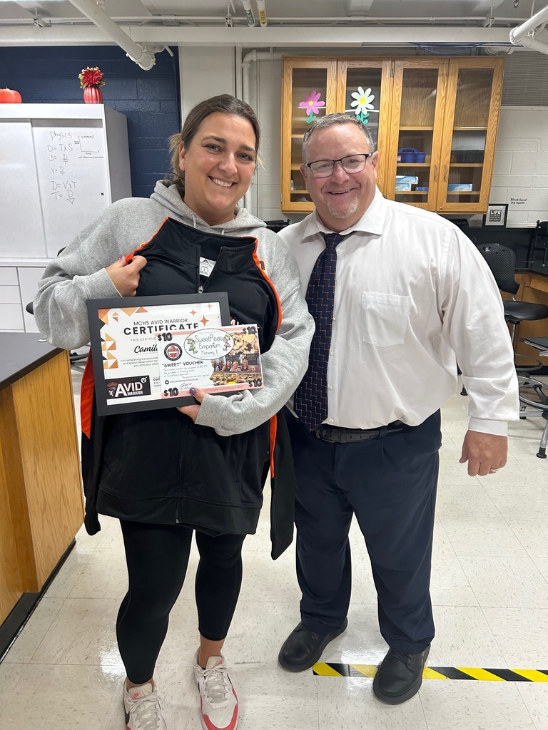 Camille with Carl Vallianatos holding her certificate