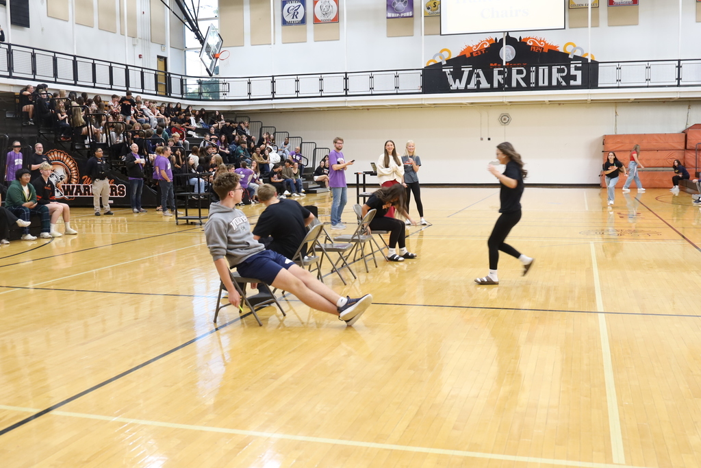 Students running to musical chairs