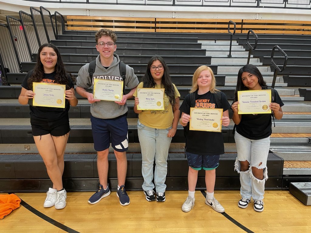 Freshmen students of the month holding their certificates