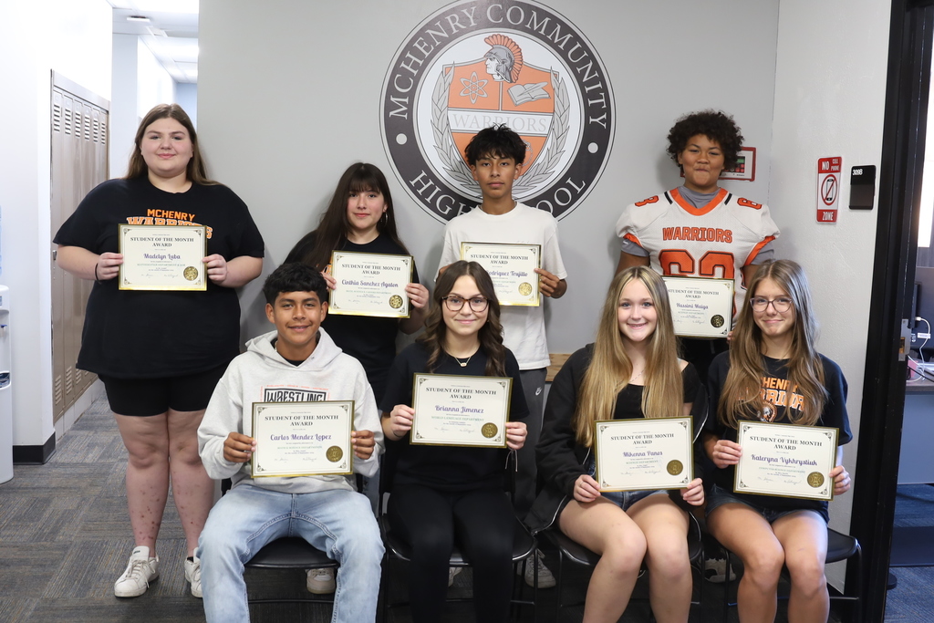Freshmen students of the month holding their certificates