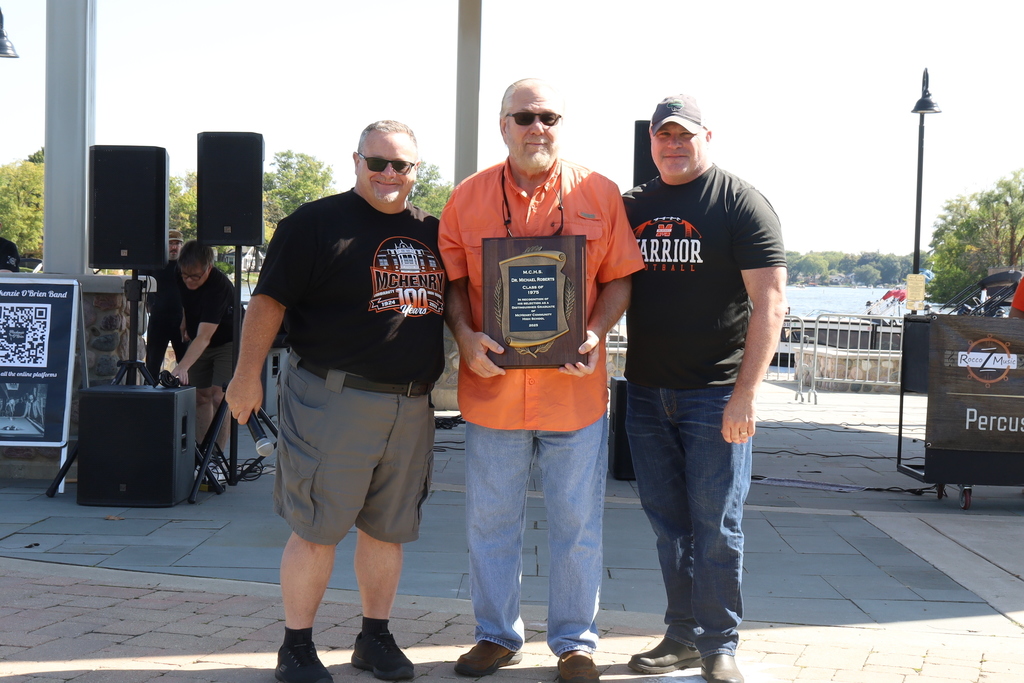 Carl Vallianatos and Dr.  McTague with Dr. Robertson and his plaque 