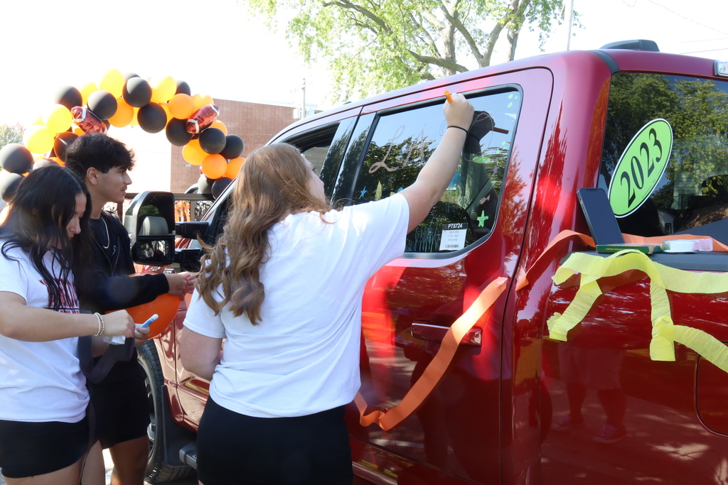 Student decorating a car