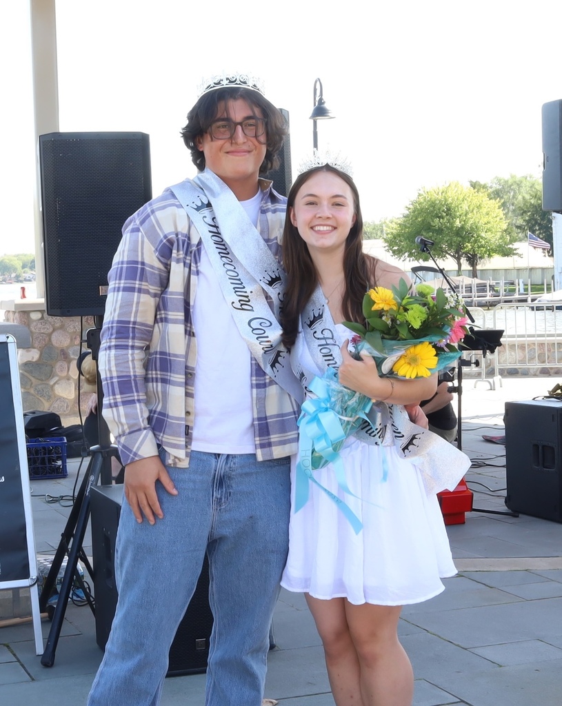Chase and Kyra: Kyra holding flowers both wearing crowns