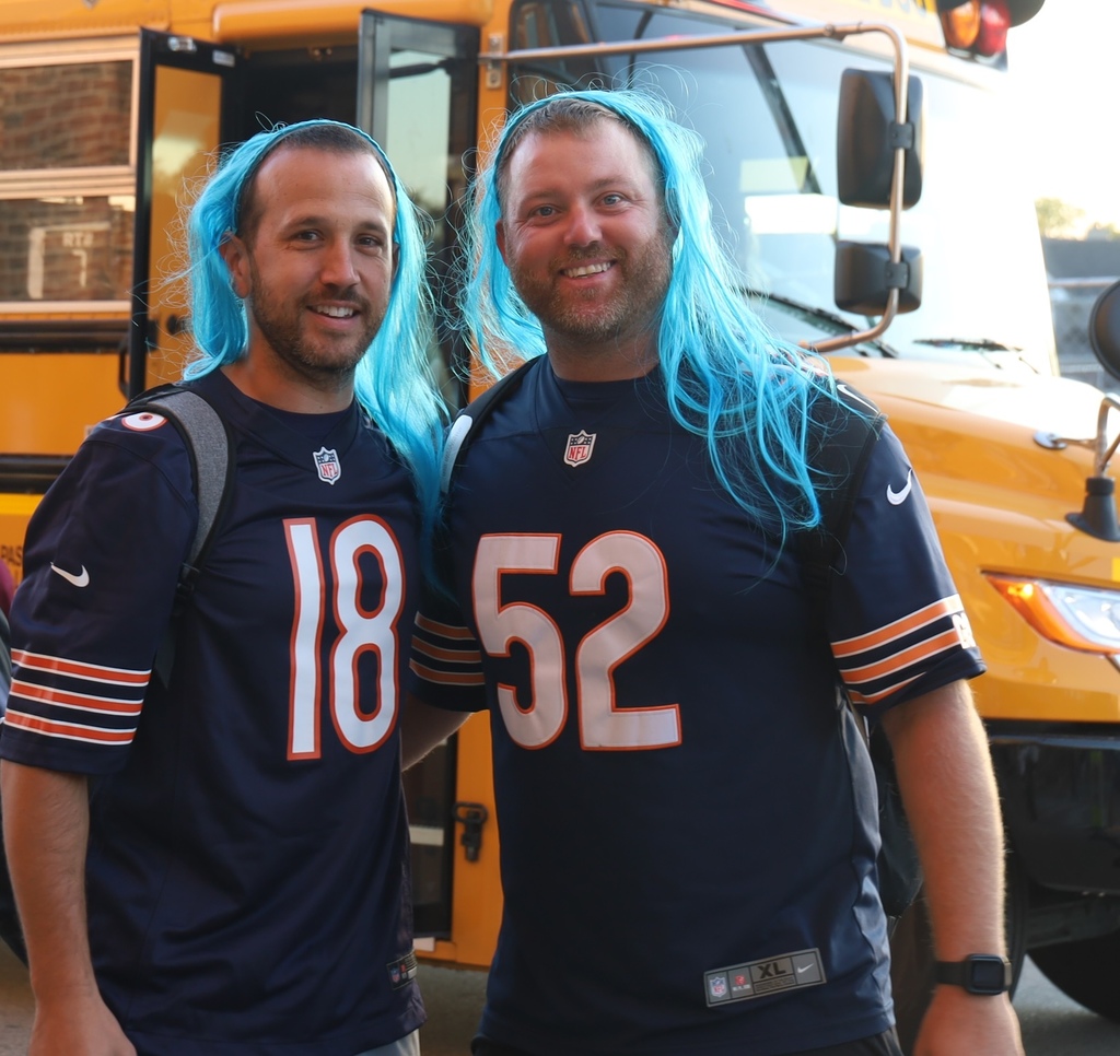 Two staff members with blue wigs 