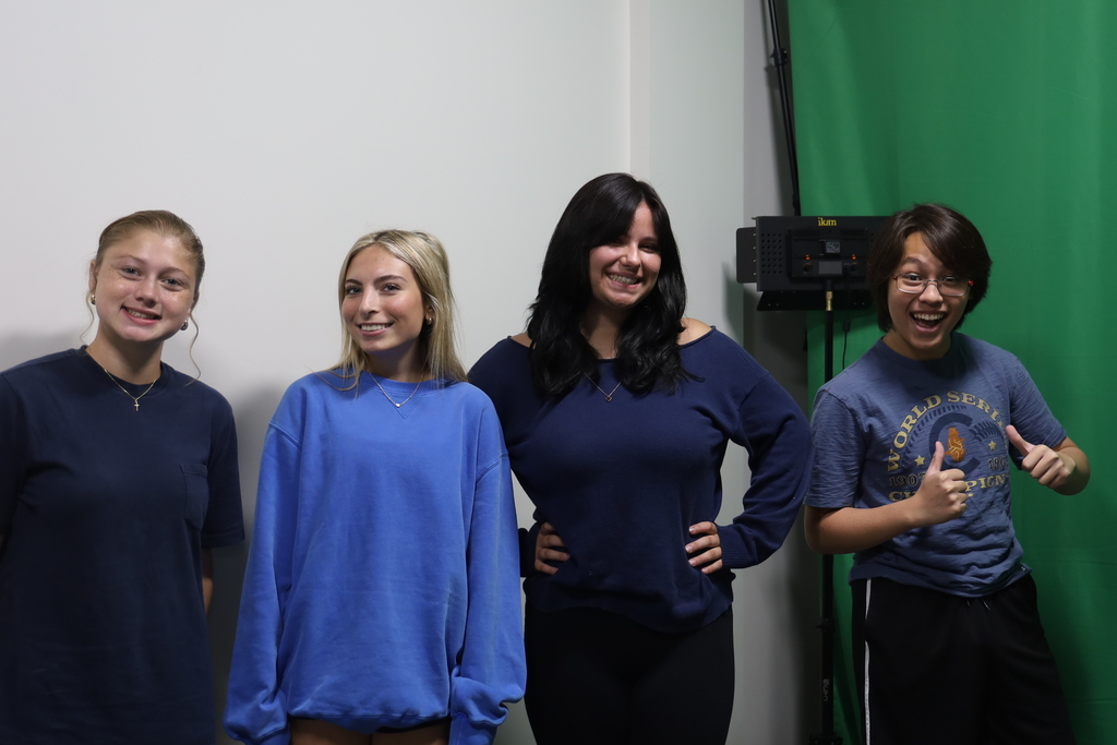 Four students in blue 