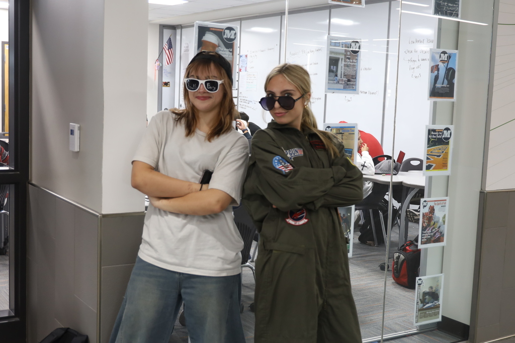 One student dressed as Soulja boy the other in Top Gun outfit 