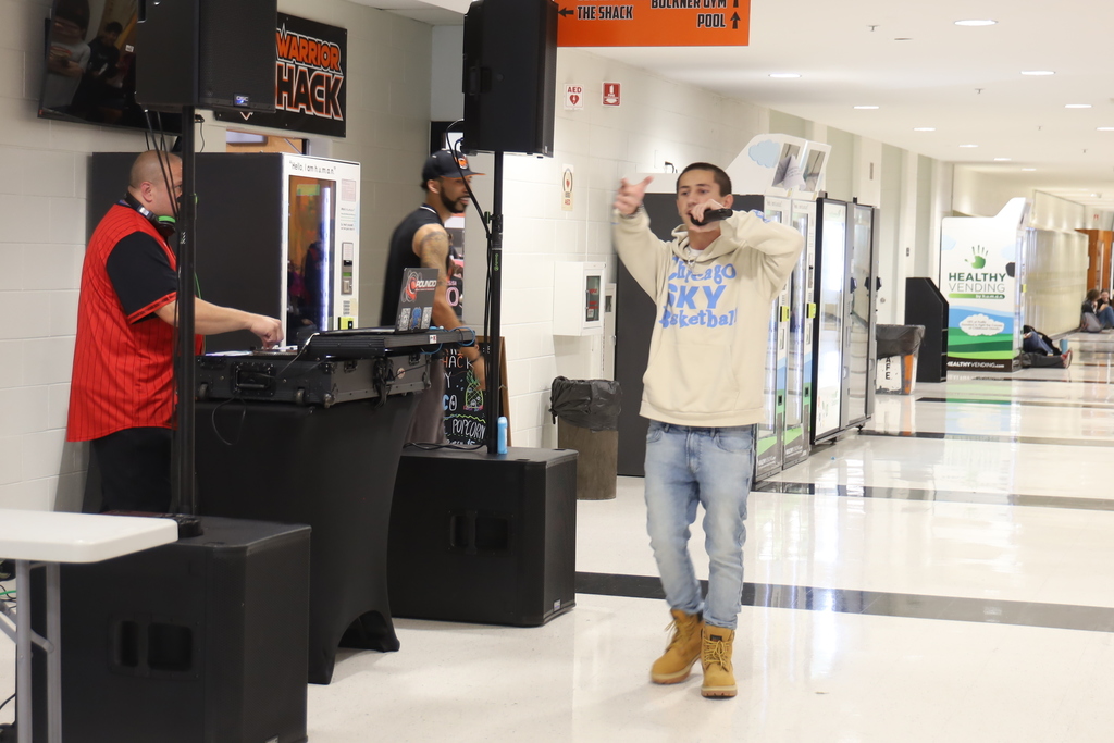 Student singing by DJ booth