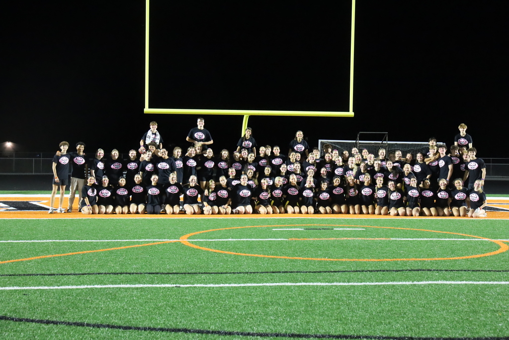 Group photo of junior team in front of goal post