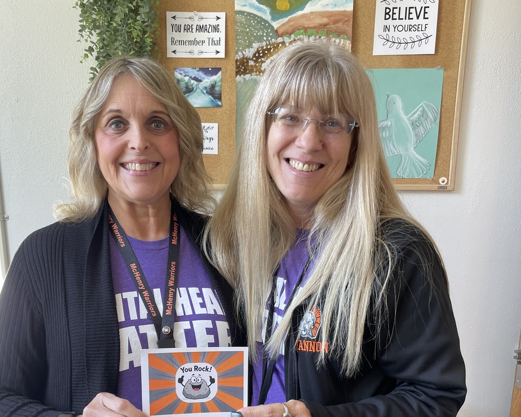 Shannon and Linnea holding "You Rock Card"